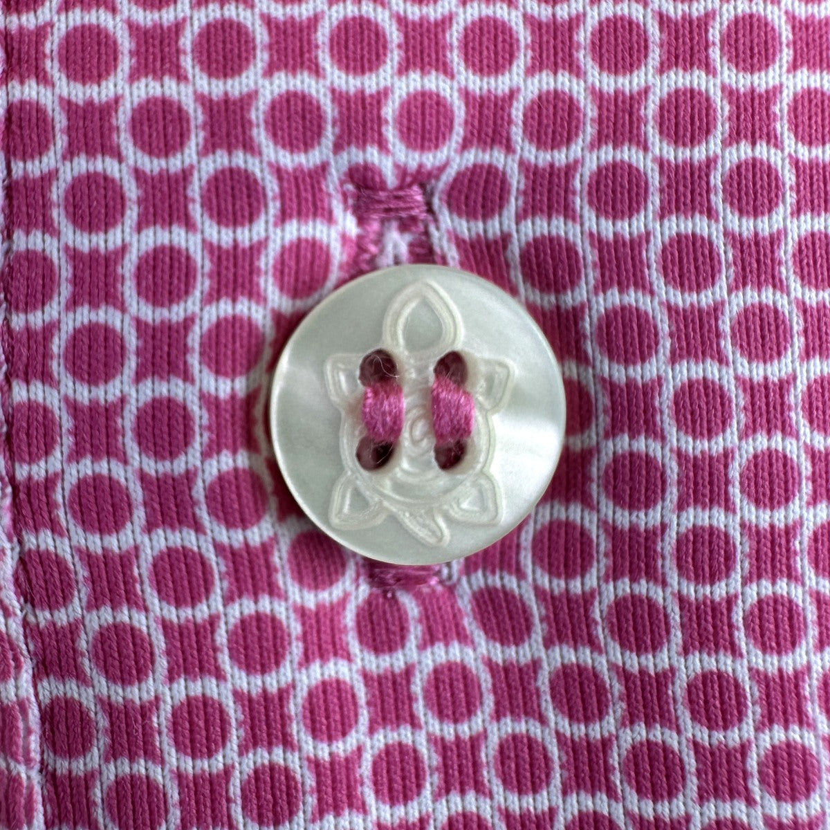 Pink 11-Stitch on pink geometric fabric
