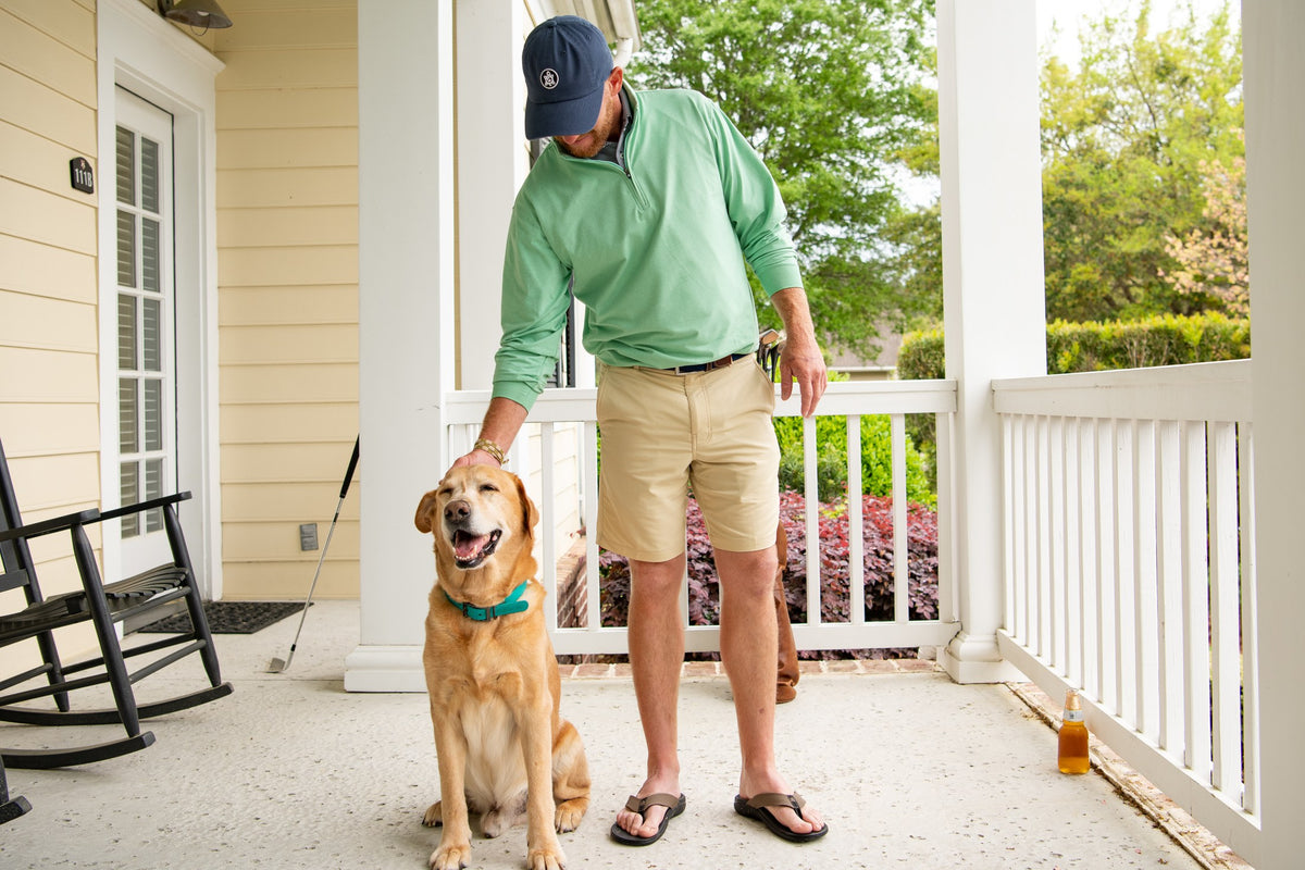A relaxed moment on the porch with a golden retriever