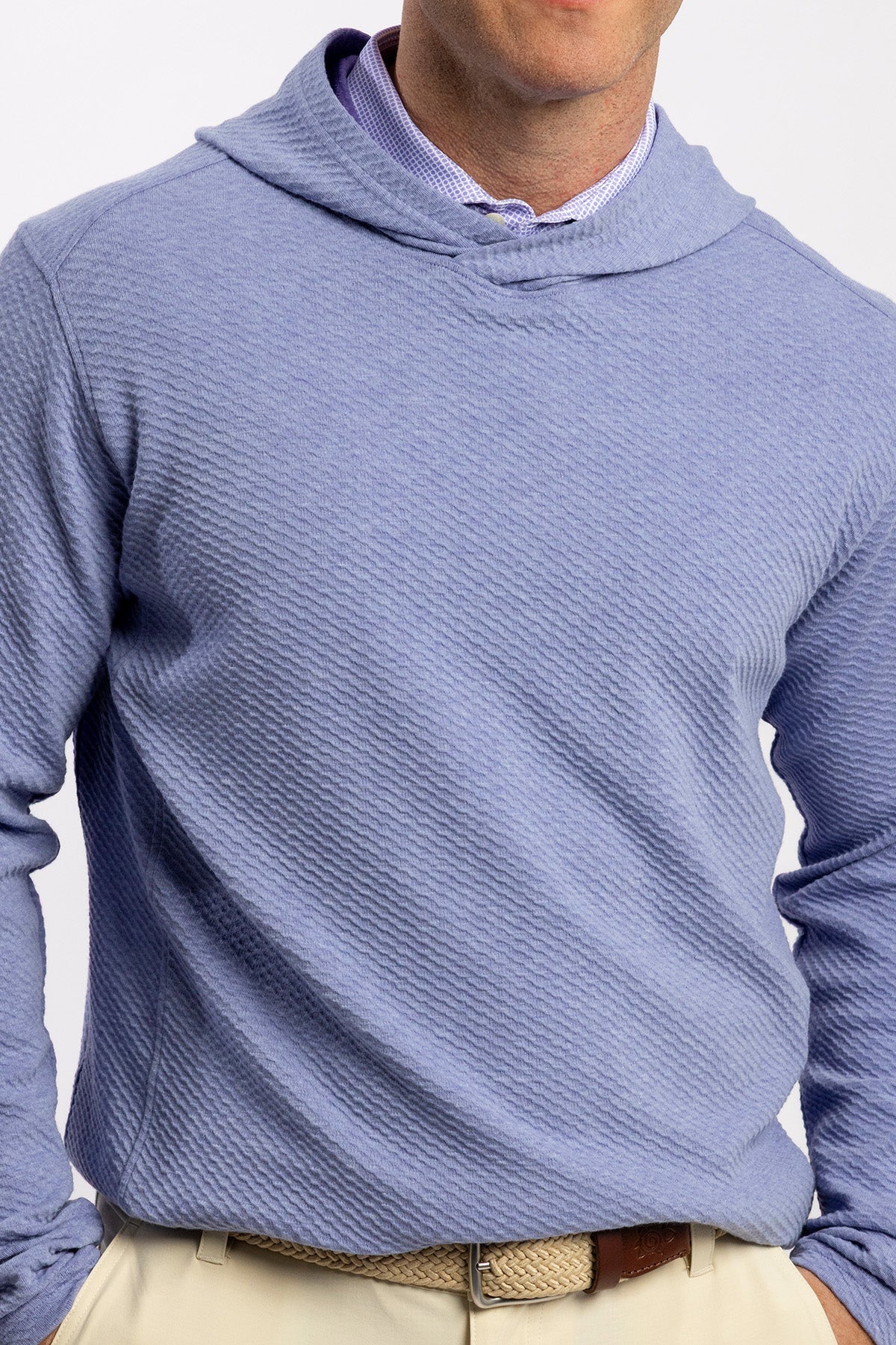 A close view of the Bellfield Hoodie worn over a collared shirt